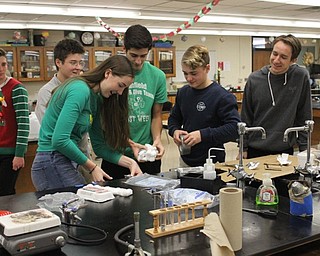 Neighbors | Abby Slanker.Canfield High School students in Tom Slaven’s Chemistry class prepared their entry in the Chemistry Cooler event during the Chemistry Olympics on Dec. 21.