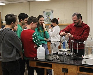 Neighbors | Abby Slanker.Canfield High School Chemistry teacher Tom Slaven tested a team’s entry in the Chemistry Cooler event during the Chemistry Olympics.