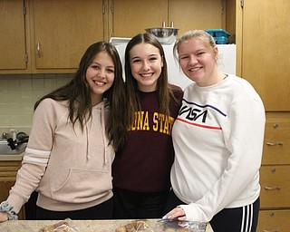 Neighbors | Abby Slanker.The Knot Just Pretzels team, from left, Sydney Leone, Christine Bennett and Maddie Impton, pitched their food truck, which offered five entrees, three sides, two desserts and dipping sauces, during Angela Alexandrides’ Culinary Arts class final class project.
