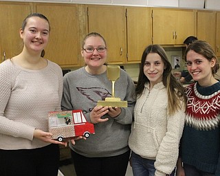 Neighbors | Abby Slanker.The food truck team of Fekety’s Firestoned Flatbreads, from left, Kayla Fekety, Kaleigh Ceci, Kate Duncko and Jenna Allender were named the winning team and were awarded the Golden Spatula trophy on Jan. 10.