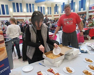 Neighbors | Jessica Harker.Judy Hopper, a teacher at Austintown Fitch High School, volunteered to serve pie for Gardner Pie Company on Jan. 26 during the school's annual Jazz and Dessert event.