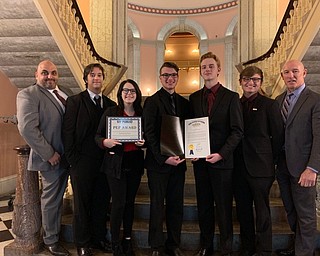 Neighbors | Submitted.Assistant High School Principal Moris Jadue, students James Valentin, Megan Frye, Matthew Welton, Sam Holter, multi-media teacher Chris Clones and Superintendent Tim Saxton hold the Public Education Partners Award and a Senate Proclamation from Senator Michael Rulli's office.