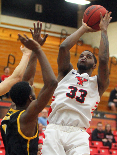 William D. Lewis The Vindicator YSU's Naz Bohannon(33) shoots over Milwaukee's DeAndre Abram(1) during 2-7-19 action ay YSU.