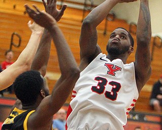 William D. Lewis The Vindicator YSU's Naz Bohannon(33) shoots over Milwaukee's DeAndre Abram(1) during 2-7-19 action ay YSU.