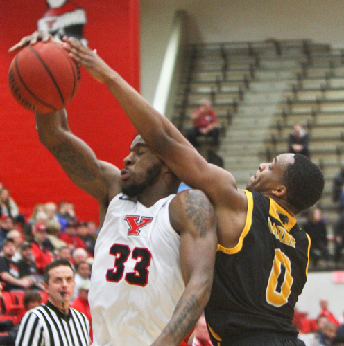 William D. Lewis The Vindicator YSU'sNazBohannon(33) and Milwaukee's Bryce Barnes(0) go for a rebound during 2-7-19 action at YSU.