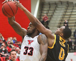 William D. Lewis The Vindicator YSU'sNazBohannon(33) and Milwaukee's Bryce Barnes(0) go for a rebound during 2-7-19 action at YSU.