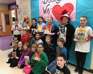 Neighbors | Submitted.Austintown Intermediate School students held up their favorite books for World Read Aloud Day on Feb. 1, where students spent the day celebrating their love of reading and their favorite things to read.