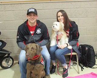Neighbors | Jessica Harker.Cory Palmer and Angela Alexandrides volunteered from Go Team therapy dogs to bring their two dogs to the Grandparents Day event at Poland Union on Feb. 5.