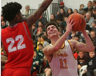 William D. Lewis the Vindicator  Mooney's Anthony Fire(11) and Chaney's Quincy Jones(22) during 2-8-19 action at Mooney.