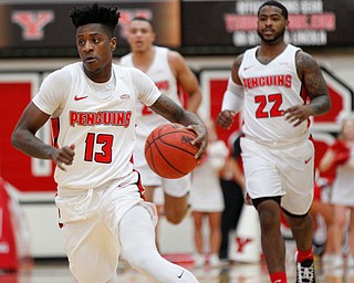 YSU's Donel Cathcart III dribbles the ball during their game against Green Bay in Beeghly Center on Saturday night. EMILY MATTHEWS | THE VINDICATOR