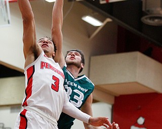 YSU's Darius Quisenberry jumps for the hoop while Green Bay's Cody Schwartz tries to block him during their game in Beeghly Center on Saturday night. EMILY MATTHEWS | THE VINDICATOR