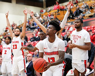 YSU's Donel Cathcart III looks toward the hoop while his teammates cheer for him during their game against Green Bay in Beeghly Center on Saturday night. EMILY MATTHEWS | THE VINDICATOR