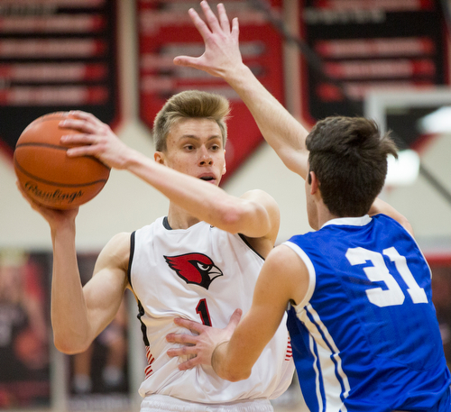 Canfield's Aydin Hanousek looks to pass the ball while Lake's Nicholas Mazzocca tries to block him during their game at Canfield High School on Tuesday night. EMILY MATTHEWS | THE VINDICATOR