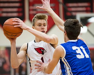 Canfield's Aydin Hanousek looks to pass the ball while Lake's Nicholas Mazzocca tries to block him during their game at Canfield High School on Tuesday night. EMILY MATTHEWS | THE VINDICATOR