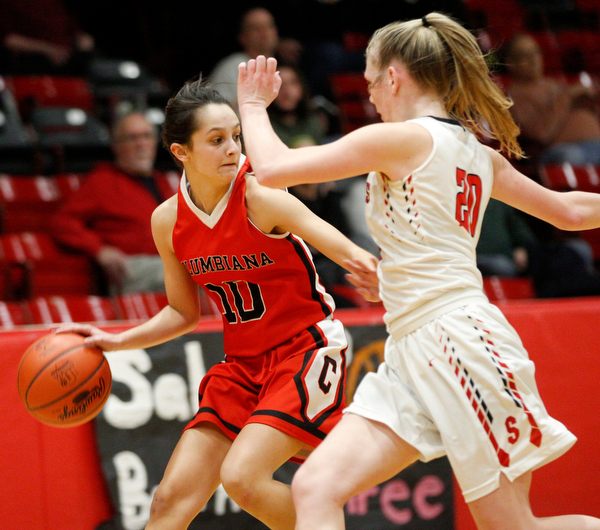 Columbiana's Grace Hammond drives the ball while Struthers' Renee Leonard tries to block her during their game at Struthers on Wednesday night. EMILY MATTHEWS | THE VINDICATOR