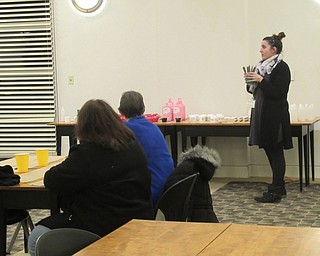 Neighbors | Jessica Harker.Librarian Renee Beverly explained to community members how to create your own lotion Jan. 24 at the Austintown branch.