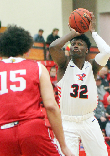 William D. Lewis YSU's NazBohannon(33) shoots over IUPUI's Ahmed Ismail(15) during 2-14-19 action at YSU.