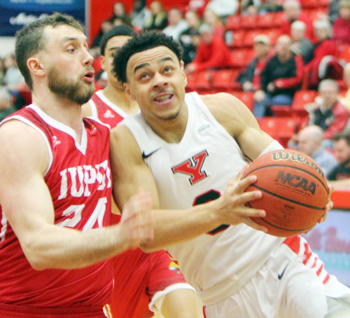 William D. Lewis YSU's Darius Quisenberry(3) drives around IUPUI's Evan Hall (24) during 2-14-19 action at YSU.