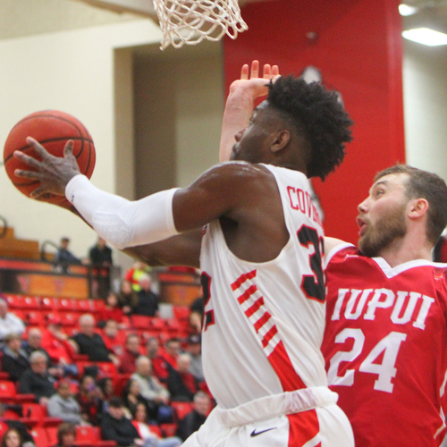 William D. Lewis YSU's Darius Garrett Covington(32) goes for 2around IUPUI's Evan Hall (24) during 2-14-19 action at YSU.