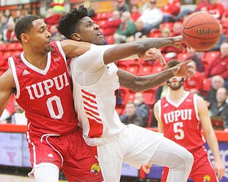 William D. Lewis YSU's Donel Cathcartlll(13) is fouled by  IUPUI's Jaylen Minnett(0) during 2-14-19 action at YSU.