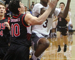 William D. Lewis The Vindicator   Boardman's Derrick Anderson(3) drives to the hoop past Canfield's Conor Crogan(10) during 2-15-19 action at Boardman.