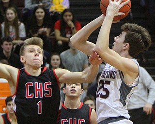 William D. Lewis The Vindicator  Boardman's Ethan Andersen(25) shoots past Canfield's Aydin Hanousek(1) and Conor Grogan (10)during 2-15-19 action at Boardman.