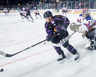 Scott R. Galvin | The Vindicator.Youngstown Phantoms forward Jack Malone (18) beats Team USA NTDP goalie Noah Grannan (31) to the puck during the second period at the Covelli Centre on Saturday, February 15, 2019.