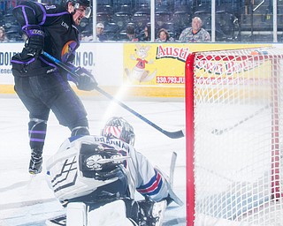 Scott R. Galvin | The Vindicator.Youngstown Phantoms forward Brett Murray (21) scores his second goal of the game against Team USA NTDP goalie Noah Grannan (31) during the second period at the Covelli Centre on Saturday, February 15, 2019.