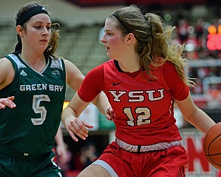 YOUNGSTOWN, OHIO - FEBRUARY 15, 2019: Youngstown State's Chelsea Olson looks to pass against Green Bay's Laken James during the second half of their game, Friday night at Beeghly Center. Youngstown State won 70-59. DAVID DERMER | THE VINDICATOR