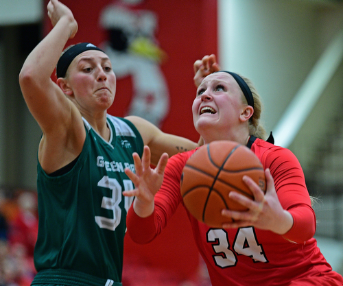 YOUNGSTOWN, OHIO - FEBRUARY 15, 2019: Youngstown State's McKenah Peters goes to the basket against Green Bay's Carly Mohns during the second half of their game, Friday night at Beeghly Center. Youngstown State won 70-59. DAVID DERMER | THE VINDICATOR
