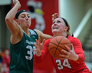 YOUNGSTOWN, OHIO - FEBRUARY 15, 2019: Youngstown State's McKenah Peters goes to the basket against Green Bay's Carly Mohns during the second half of their game, Friday night at Beeghly Center. Youngstown State won 70-59. DAVID DERMER | THE VINDICATOR