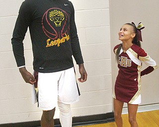 William D. Lewis TheVindicator  Jessalyn Hartsfield, who suffers from primordial dwarfismand is a liberty hs jv cheerleader shares a moment with Liberty basketball player Ezell Brown before a 2-5-19 game.