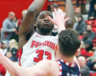 William D. Lewis The Vindicator YSU's Naz Bohannon(33) shoots over UIC's Jordan Blount(13) during 2-16-19 action at YSU.