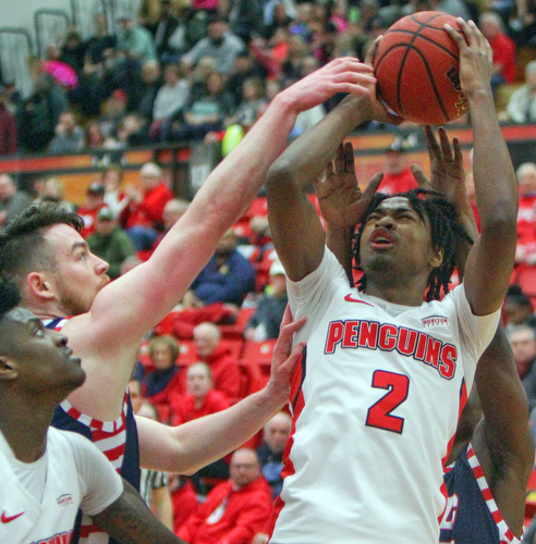 William D. Lewis The Vindicator YSU'sJelani Simmons(2) tries to shoot pastUIC's Jordan Blount(13) during 2-16-19 action at YSU.