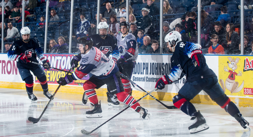 Scott R. Galvin | The Vindicator.Youngstown Phantoms forward Dalton Messina (14) looks for an open player to pass to against Team USA NTDP during the second period at the Covelli Centre on Saturday, February 16, 2019.