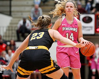 YSU's Melinda Trimmer looks toward the hoop while Milwaukee's Bre Cera tries to block her during their game in Beeghly Center on Sunday afternoon. EMILY MATTHEWS | THE VINDICATOR