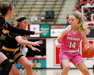 YSU's Melinda Trimmer drives the ball while Milwaukee's Megan Walstad, left, and Mckaela Schmelzer try to block her during their game in Beeghly Center on Sunday afternoon. EMILY MATTHEWS | THE VINDICATOR