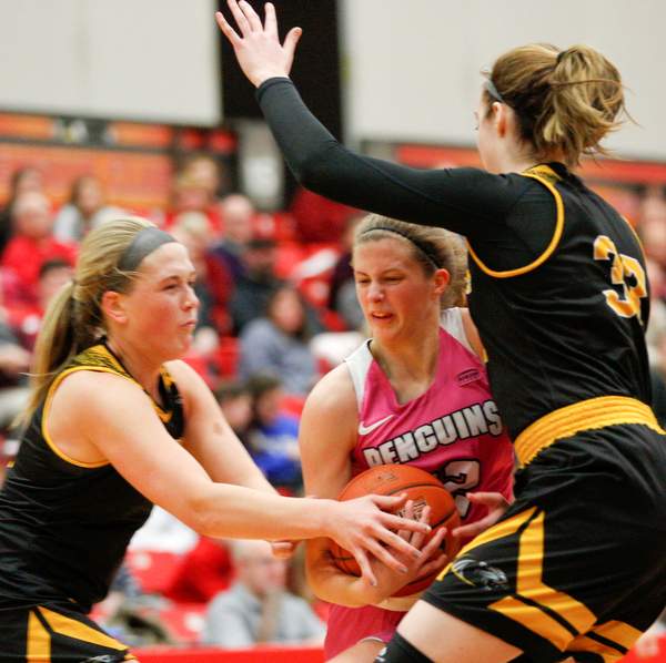 YSU's Chelsea Olson drives the ball while Milwaukee's Sydney Staver, left, tries to grab the ball and Megan Walstad, right, tries to block Olson during their game in Beeghly Center on Sunday afternoon. EMILY MATTHEWS | THE VINDICATOR