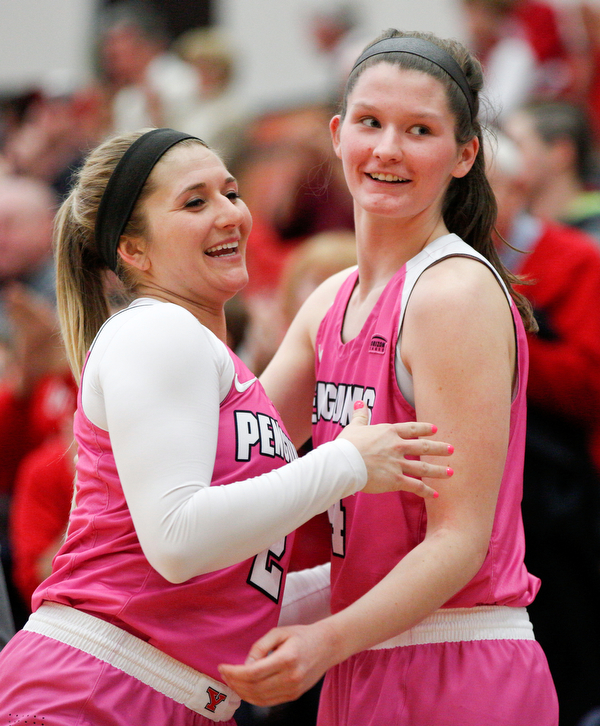 YSU's Alison Smolinski, left, and Madison Mallory hug after Smolinski comes off the court during their game against Milwaukee in Beeghly Center on Sunday afternoon. EMILY MATTHEWS | THE VINDICATOR