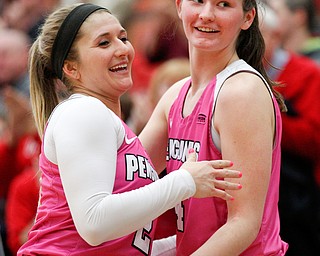 YSU's Alison Smolinski, left, and Madison Mallory hug after Smolinski comes off the court during their game against Milwaukee in Beeghly Center on Sunday afternoon. EMILY MATTHEWS | THE VINDICATOR