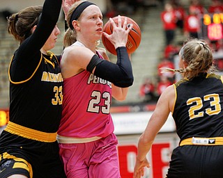 YSU's Sarah Cash looks to pass the ball while Milwaukee's Megan Walstad tries to block her during their game in Beeghly Center on Sunday afternoon. EMILY MATTHEWS | THE VINDICATOR