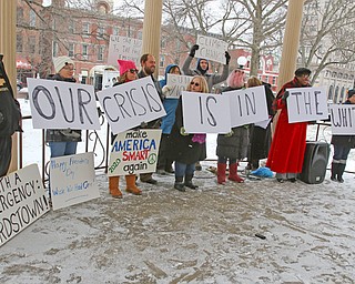 People protested at the gazebo in Warren’s Courthouse Square on Monday and spoke out against Trump’s declaration of a national emergency at the southern U.S. border.