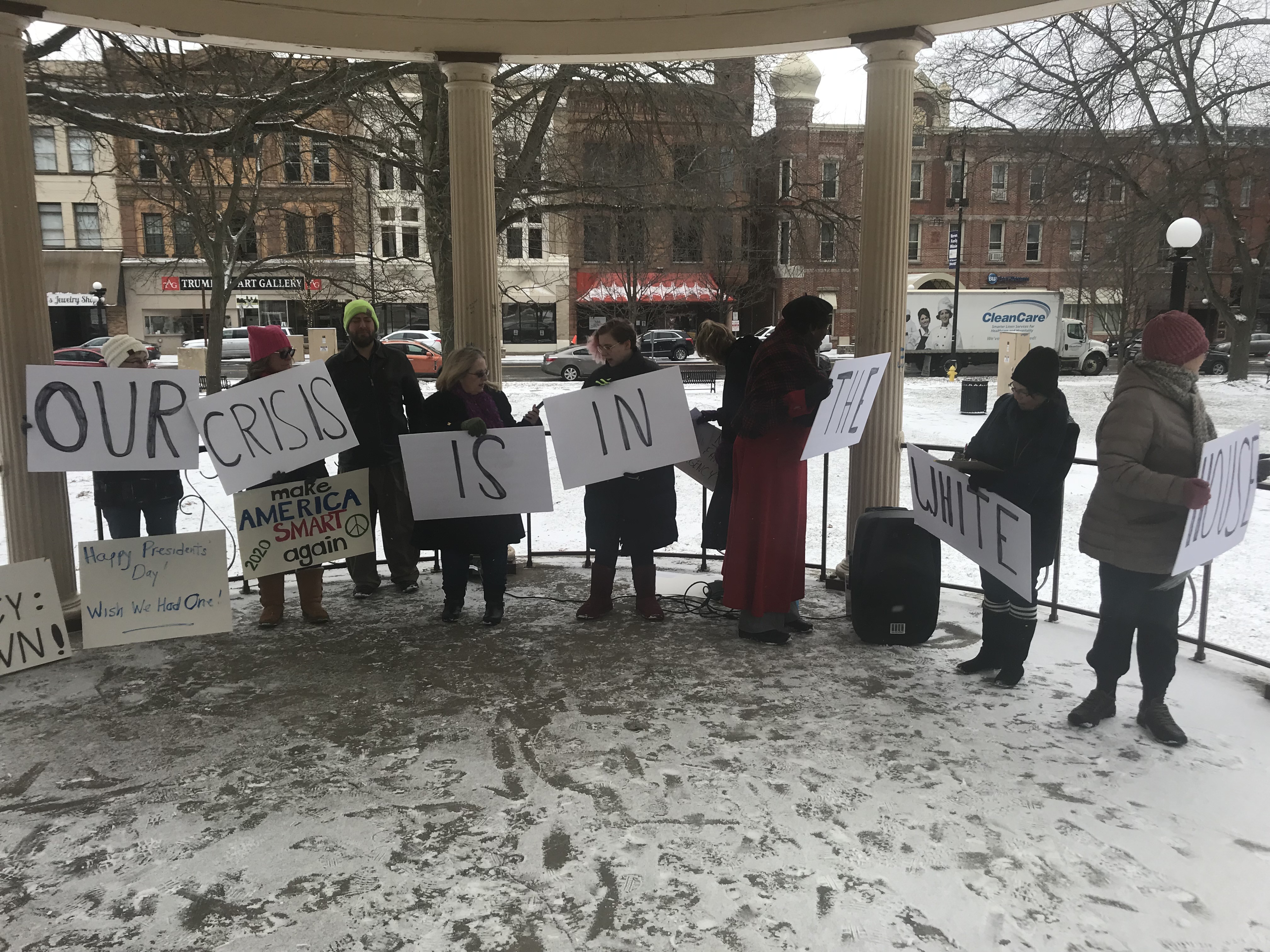 About 20 people assembled on the gazebo and Courthouse Square to protest President Trump‘s declaration of a national emergency to build a border wall. 