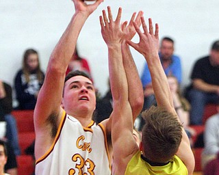 William D. Lewis The vindicator Mooney's John Murphy(33) shoots past Bristol's Zach Stern(21).