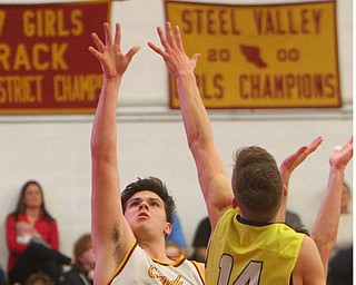 William D. Lewis The Vindicator Mooney's Mike Pelini(14) shoots past Bristol's Matt Church(14).