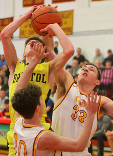 William D. Leiws The vindicator  Bristol's Elza Gage(2) tries to shoot past Mooney's Tommy Fire(10) and John Murphy(33).