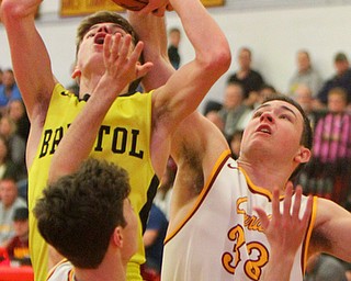 William D. Leiws The vindicator  Bristol's Elza Gage(2) tries to shoot past Mooney's Tommy Fire(10) and John Murphy(33).