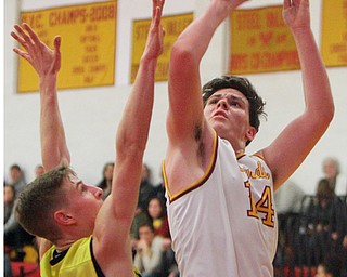 William D Lewis The Vindicator Mooney's Mike Pelini(14) shoots past Bristol's Matt Church(14)..