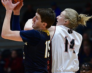 STRUTHERS, OHIO - FEBRUARY 19, 2019: Lowellville's Jake Rotz, left, grabs a rebound away from Struthers, Billy Opritza during the first half of their game, Tuesday night at Struthers High School. Lowellville won 55-48. DAVID DERMER I THE VINDICATOR