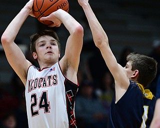 STRUTHERS, OHIO - FEBRUARY 19, 2019: Struthers' Trey Metzka shoots a three point shot over Micah Mamula-Zarlingo during the first half of their game, Tuesday night at Struthers High School. Lowellville won 55-48. DAVID DERMER I THE VINDICATOR